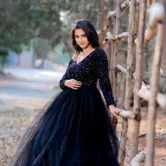 A full-length outdoor shot featuring a black evening gown. I created a smoky eye with a pop of pink and a nude lip to create a dramatic yet elegant look for this fashion shoot.