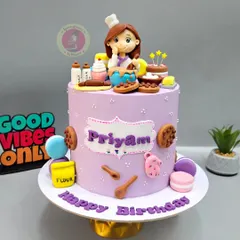 A full view of a baker-themed birthday cake. This one includes tiny fondant flour sacks, spoons, and oven mitts for a complete baking scene.