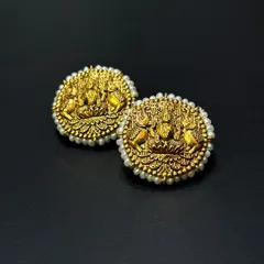 One of my most classic pieces, these 22kt gold earrings feature Maa Laxmi and are bordered with tiny pearls. This is the kind of piece that can be passed down through generations, carrying blessings with it.
