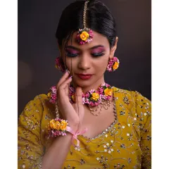 A detailed shot focusing on the floral jewelry, including the necklace, earrings, and maang tikka. This is ideal for showcasing accessory collections.