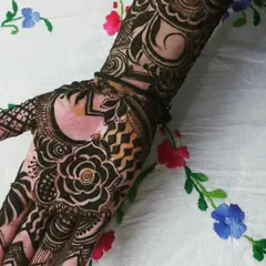 A modern take on festive mehendi for my first client. I mixed a bold rose motif with geometric patterns and delicate finger details for a unique and personalized design.