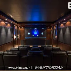 We design and install dedicated home cinema rooms that deliver an unparalleled audio-visual experience. This setup features acoustically treated walls, tiered luxury seating, and a professionally calibrated projection system for true cinematic immersion.