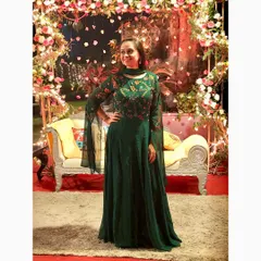 This elegant emerald green Anarkali gown is perfect for a wedding reception or sangeet. I chose this piece for its stunning color and trendy playful sleeves, which add a modern twist to a classic silhouette.