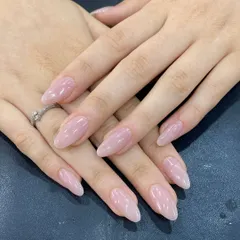 A perfect example of a simple, clean look. These are beautifully shaped, natural-looking extensions with a sheer pink gel polish for a healthy and polished appearance.