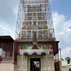 An interesting observation of a geometric mesh enclosure around a traditional temple gopuram in Devanahalli. It creates a curious juxtaposition of modern engineering and historic craftsmanship.