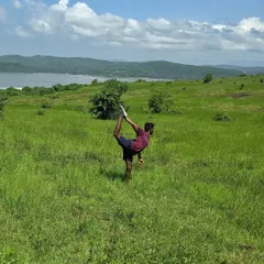 Practicing Natarajasana (Dancer's Pose) in a field in Gokarna. For me, setting a stage for practice is like worshipping the body, finding beauty in the movement and the surroundings.