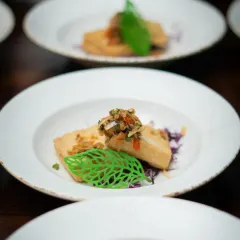 Another exquisite dish from our global tasting menu. This close-up highlights the careful preparation and artistic plating that goes into every course, ensuring the food is as beautiful as it is flavorful.