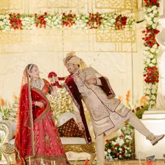 A playful moment during the Varmala ceremony at a royal wedding in Pushkar, capturing the fun and joy of the couple.