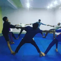 Our athletes work together in partner-assisted stretches. This method helps safely increase flexibility in the legs and hips, which is essential for powerful kicks.