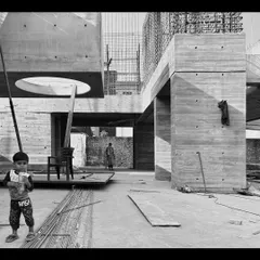 A moment during the construction of the Moradabad villas, showing the scale of the concrete forms and a circular skylight opening.