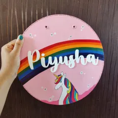 I love creating these custom unicorn-themed nameplates for kids' rooms. Hand-painted on a sturdy wooden base, this piece for Piyusha features a vibrant rainbow and a magical unicorn, bringing a touch of personalized joy to a child's door.