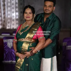 A sweet moment between the happy couple. The temple jewellery adds a touch of tradition and grandeur to her baby shower celebration.