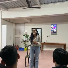 A participant in a corporate workshop discovers her inner puppeteer. My sessions for teams are about experimenting, playing, and finding the joy in a new skill, which is a fantastic way to build camaraderie.