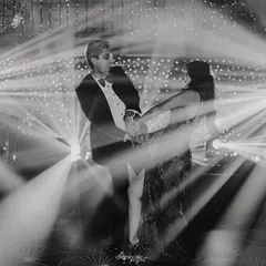 The energy of the first dance captured with creative lighting and converted to a high-impact black and white image.