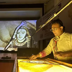 A close up of my sand art performance. With my hands, I shape the sand to create intricate and beautiful images that flow from one to the next.