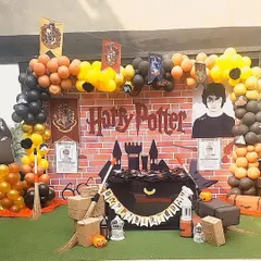 Welcome to Hogwarts! For all the little wizards and witches, I create a magical Harry Potter world. This setup includes the iconic brick wall backdrop, house banners, and all the little details for an enchanting birthday experience.