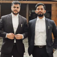 With a colleague outside the court. The legal profession is demanding, and having a strong professional network and supportive peers is invaluable. Hard work and collaboration are key to achieving success for our clients.
