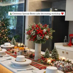 The studio all set up and looking festive for a Christmas bento cake decorating workshop. The table is ready with blank cakes and all the decorating supplies.