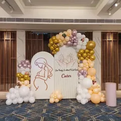 For this baby shower, I created an elegant and modern backdrop using arched panels and a custom organic balloon garland. The soft colors and clean lines are perfect for a sophisticated celebration for the mom-to-be.