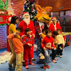 Santa Claus and J the Fox team up to bring holiday cheer to the kids during our Christmas party.