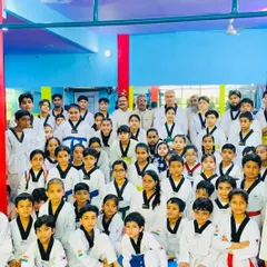 A full house at the dojang. This group photo captures the energy and diversity of our students, all united by their passion for Taekwondo.