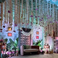 We designed this 'Southern Grace' baby shower entrance as a doorway to new life. The antique wooden door, traditional floral hangings, and lush greenery create a warm, inviting atmosphere rooted in cultural elegance.