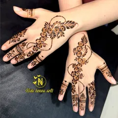 This is a beautiful Arabic style floral trail. The design flows diagonally across the back of the hand, creating an elegant and sophisticated look for any party or event.