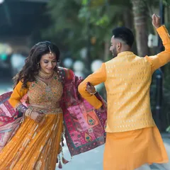 A couple lost in the rhythm during their Sangeet performance. We love capturing the dynamic movement and colors of dance.