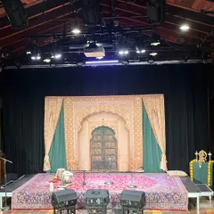 The stage is set for a private baithak in Phoenix. Even in a smaller setting, we ensure professional sound and a beautiful backdrop to create a complete concert experience.