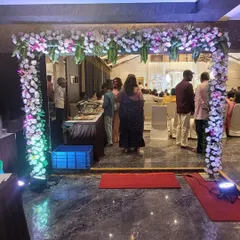 An indoor floral archway like this one for an engagement ceremony helps define the event space and creates a beautiful photo opportunity for guests as they enter the main hall.