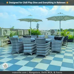 This rooftop is designed for everything from chilling to playing. I installed stylish rattan furniture under large umbrellas for dining and lounging, alongside a dedicated cricket net, making it a truly multi-functional lifestyle zone.