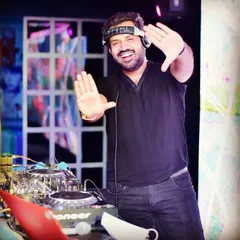 A happy, energetic shot of me at the console, ready to kick off a fantastic February. This photo captures my positive attitude and passion for bringing great music to every party.
