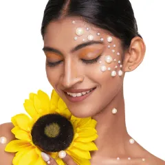 A 'soul-flower' concept, where we combined the radiance of a sunflower with the delicate beauty of pearls. This is a perfect example of a creative beauty portrait.