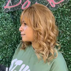 A warm, golden blonde global color. Achieving this level of lightness and even tone requires skill and the right products to keep the hair healthy.