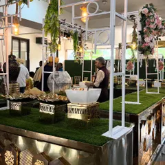 This is one of my modern buffet setups, designed with a clean white frame, elegant florals, and gold accents to create a grand first impression for your event guests.