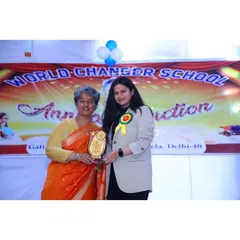 Receiving a memento at the school event. Moments like these reinforce my commitment to being a positive force both inside and outside the courtroom.