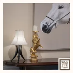 A regal, golden lion candle stand adds a touch of majestic sophistication to this console table. It's a perfect accent piece for those who appreciate decor that is both beautiful and symbolic of strength and luxury.