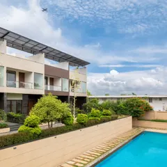 For this community swimming pool, the goal was to create a private, serene retreat within an urban setting. I used layered planting and shifts in level to build natural visual and acoustic barriers. The result is a minimal, sleek design where clean lines and curated textures create a peaceful escape.