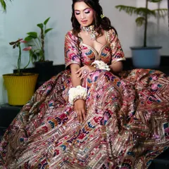 A full shot of the Mehendi look. The multi-colored lehenga is perfect for a day function, and the makeup is kept fresh and glowing.
