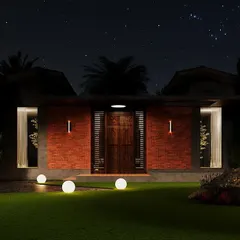 This rendering explores a dramatic lighting scheme for a modern farmhouse entrance. I used a combination of glowing spheres scattered across the lawn and sleek, vertical post lights to create a captivating, almost celestial effect. This approach to outdoor lighting turns the front yard into a piece of art at night.