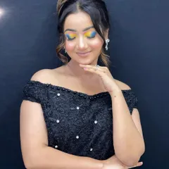 Another pose showcasing the artistic, painted style of this multi-colored eye makeup.