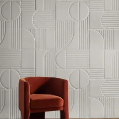 A testament to modern innovation, our Soft Surrounds 3D wallcovering creates a large-scale geometric feature that is both visually striking and acoustically functional. Paired with a bold, sculptural armchair, this setting highlights our ability to integrate cutting-edge materials with statement upholstery for a truly contemporary feel.
