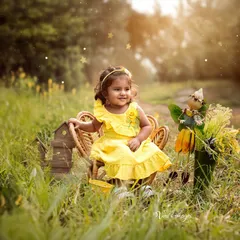 Bathed in the magic of golden hour. I took this little one to a field just before sunset to capture this radiant, joyful portrait. Outdoor sessions like this use natural light to create a warm, dreamy atmosphere that feels truly timeless.
