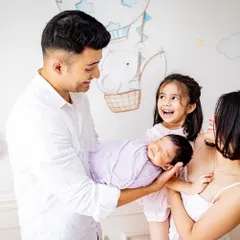 A beautiful family of four celebrating their newest member. I love capturing these moments against the backdrop of your baby's own nursery.
