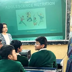 Interaction is key during my adolescent nutrition sessions. Here, I'm engaging with students at a Delhi government school, answering their questions about healthy eating and how it impacts everything from their energy levels to their mood.