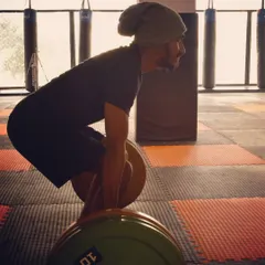 Proper form on a deadlift. Notice the flat back and engaged core. We train smart to build functional strength and avoid injury.
