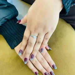 This manicure combines rich color with sparkling glitter. I created a deep maroon base and added a silver glitter ombre effect on the tips for a dramatic and festive design.