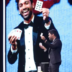 A perfect moment of card magic on a grand scale. The card I'm holding in my hand is magically revealed, and the giant screen behind me ensures that all 500+ guests at the Taj Hotels conference experience the reveal at the same time.