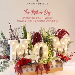 For Mother's Day, I wanted to create something that literally spells out love. This statement hamper features illuminated 'MOM' letters nestled in a bed of fresh, vibrant florals, making it a tribute to her love, strength, and magic.