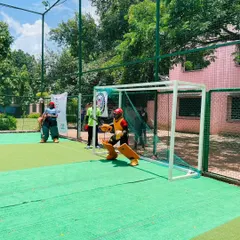 The goalkeeper is set and ready as a player approaches. Goalie training is about anticipation and positioning as much as it is about reflexes.